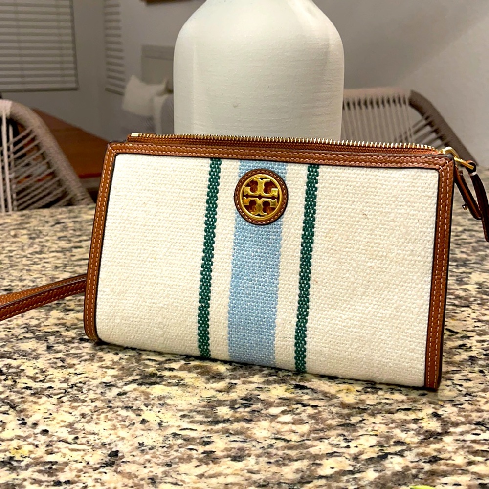 This season Tory Burch clutch with wallet pockets!